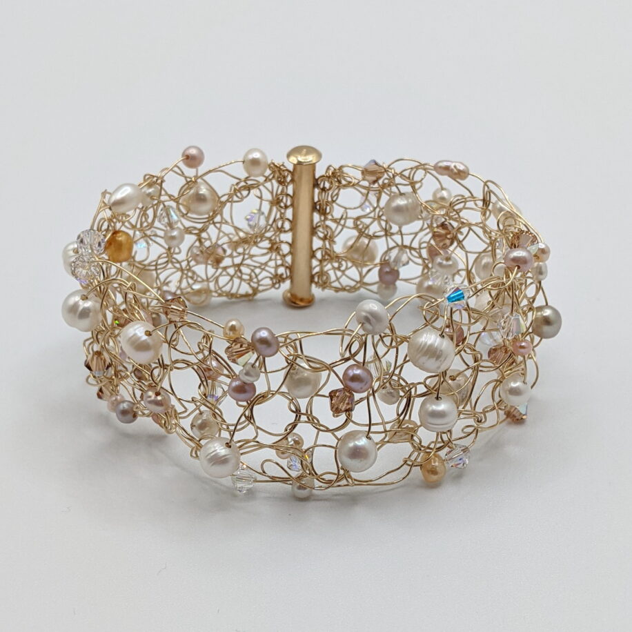 Gold-Fill Crochet Bracelet with White & Pink Pearls & Swarovski Crystals by Veronica Stewart at The Avenue Gallery, a contemporary fine art gallery in Victoria, BC, Canada.
