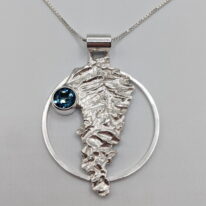 Lunar Over Moon Pendant with London Blue Topaz by A & R Jewellery at The Avenue Gallery, a contemporary fine art gallery in Victoria, BC, Canada.