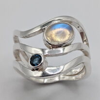 Wind Design Ring with Moonstone & London Blue Topaz by A & R Jewellery at The Avenue Gallery, a contemporary fine art gallery in Victoria, BC, Canada.