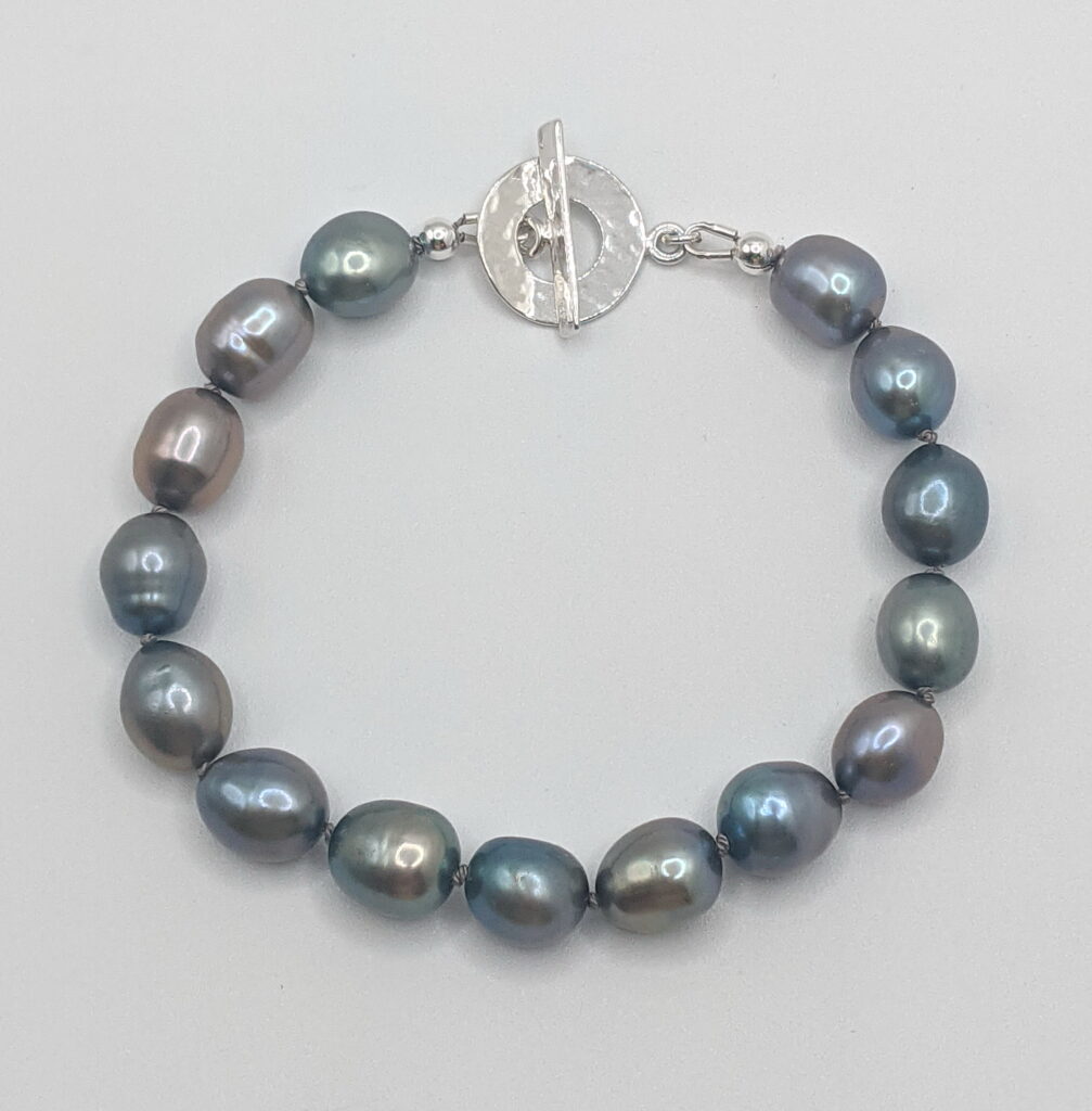 Dark Grey Blue Freshwater Pearl Bracelet with Toggle Clasp by Val Nunns at The Avenue Gallery, a contemporary fine art gallery in Victoria, BC, Canada.