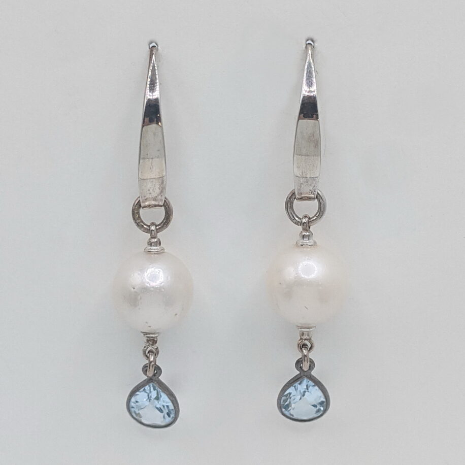 Freshwater Pearl Earrings with Topaz dangle set on Sterling Silver Wires by Val Nunns at The Avenue Gallery, a contemporary fine art gallery in Victoria, BC, Canada.