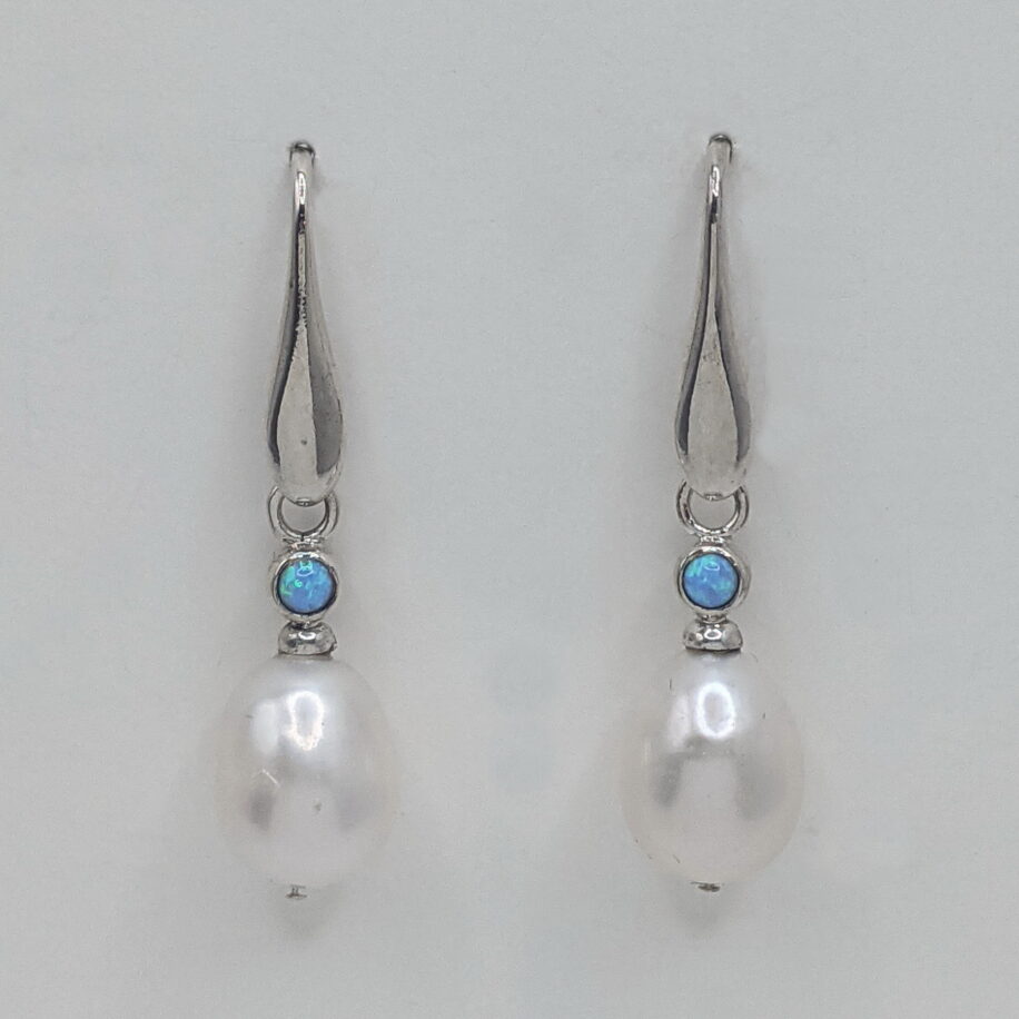 Sterling Silver Setting with a Small Opal and Freshwater Pearl by Val Nunns at The Avenue Gallery, a contemporary fine art gallery in Victoria, BC, Canada.