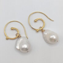 White Baroque Pearl Earrings set on Gold Plated Curly Wire by Val Nunns at The Avenue Gallery, a contemporary fine art gallery in Victoria, BC, Canada.