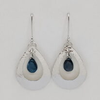 Cut-Out Teardrop Earrings with London Blue Topaz by A & R Jewellery at The Avenue Gallery, a contemporary fine art gallery in Victoria, BC, Canada.