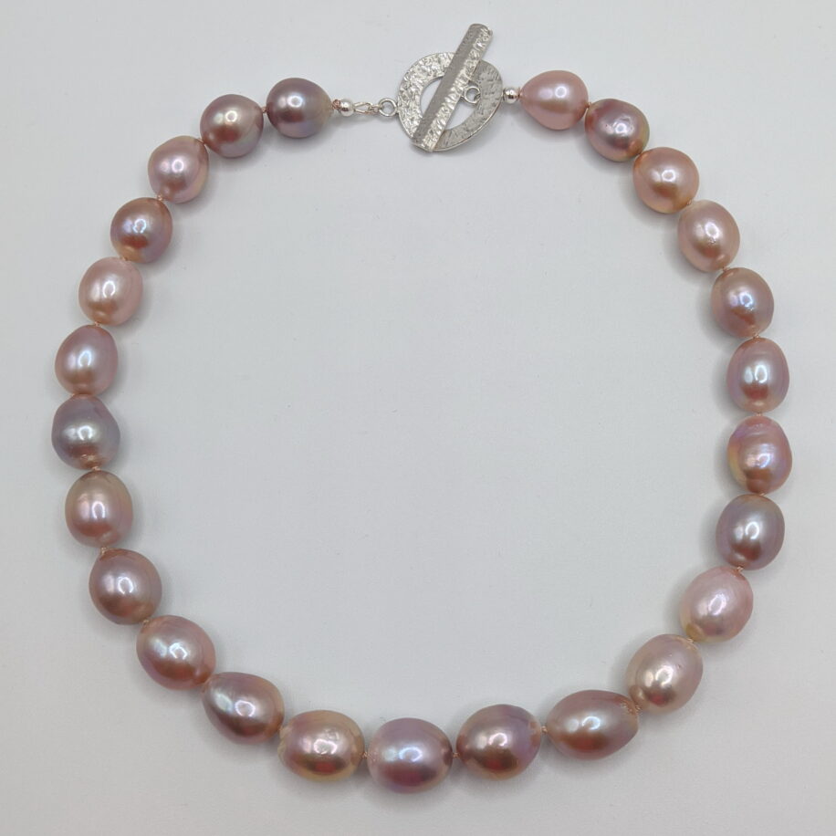 Pink Edison Pearl Necklace with Hammered Sterling Silver Clasp by Val Nunns at The Avenue Gallery, a contemporary fine art gallery in Victoria, BC, Canada.