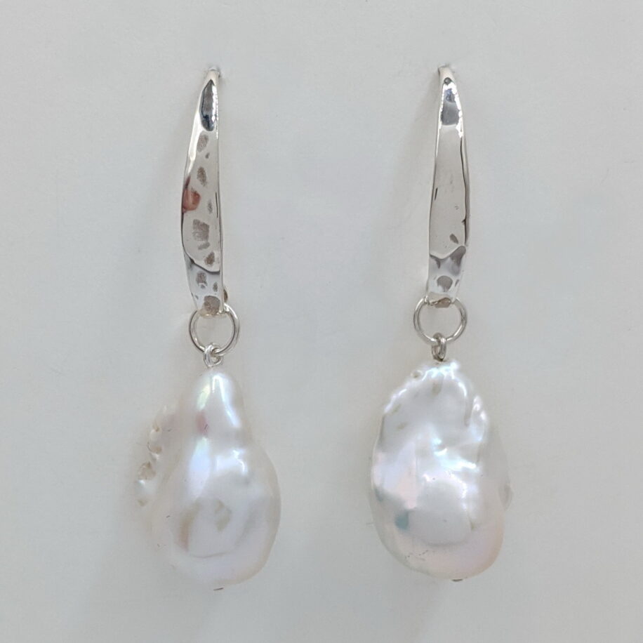 White Baroque Pearl Earrings with Hammered Sterling Silver Wires by Val Nunns at The Avenue Gallery, a contemporary fine art gallery in Victoria, BC, Canada.