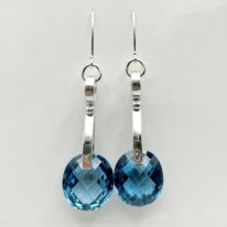 London Blue Topaz on Wave Curl Earrings by A & R Jewellery at The Avenue Gallery, a contemporary fine art gallery in Victoria, BC, Canada.