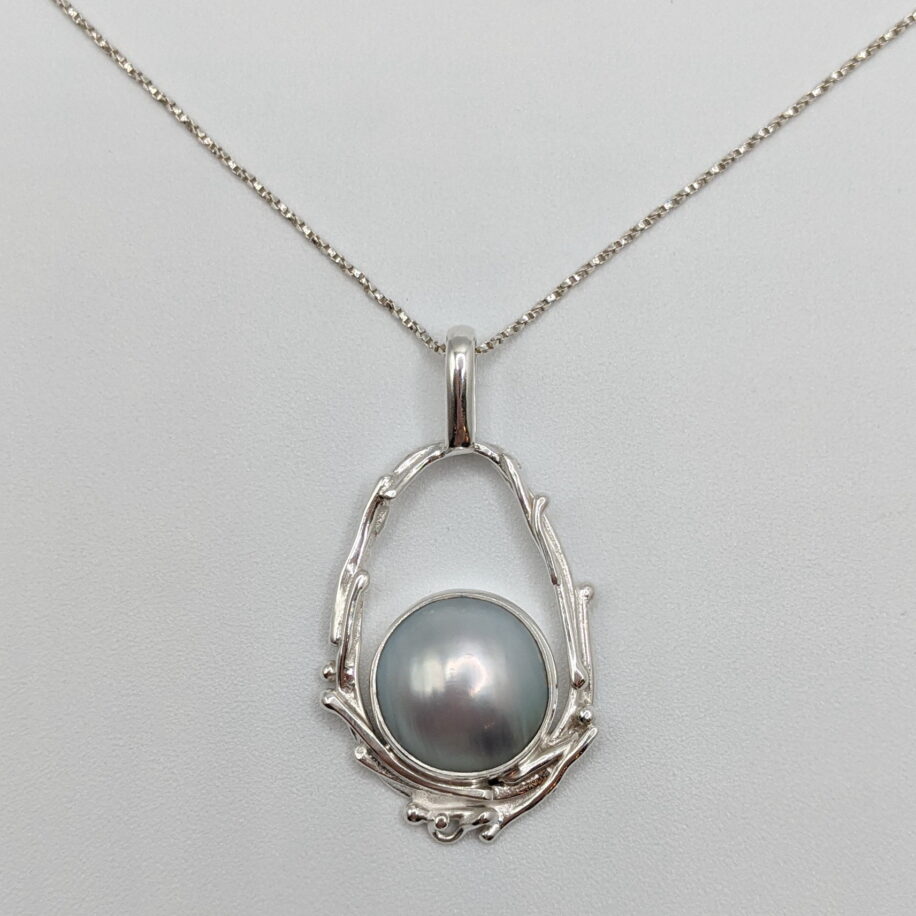 Pearl in Hollow Boulder Pendant by A & R Jewellery at The Avenue Gallery, a contemporary fine art gallery in Victoria, BC, Canada.