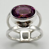 Round Double-Band Ring with Raspberry Topaz by A & R Jewellery at The Avenue Gallery, a contemporary fine art gallery in Victoria, BC, Canada.