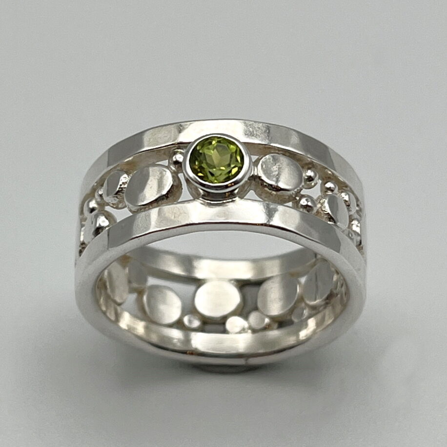 Flat Granules Ring with Peridot by A & R Jewellery at The Avenue Gallery, a contemporary fine art gallery in Victoria, BC, Canada.