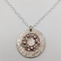 Large Round Textured Pendant with Pearls & Swarovski Crystals by Veronica Stewart at The Avenue Gallery, a contemporary fine art gallery in Victoria, BC, Canada.