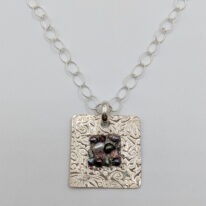 Small Square Textured Pendant with Pearls & Swarovski Crystals by Veronica Stewart at The Avenue Gallery, a contemporary fine art gallery in Victoria, BC, Canada.