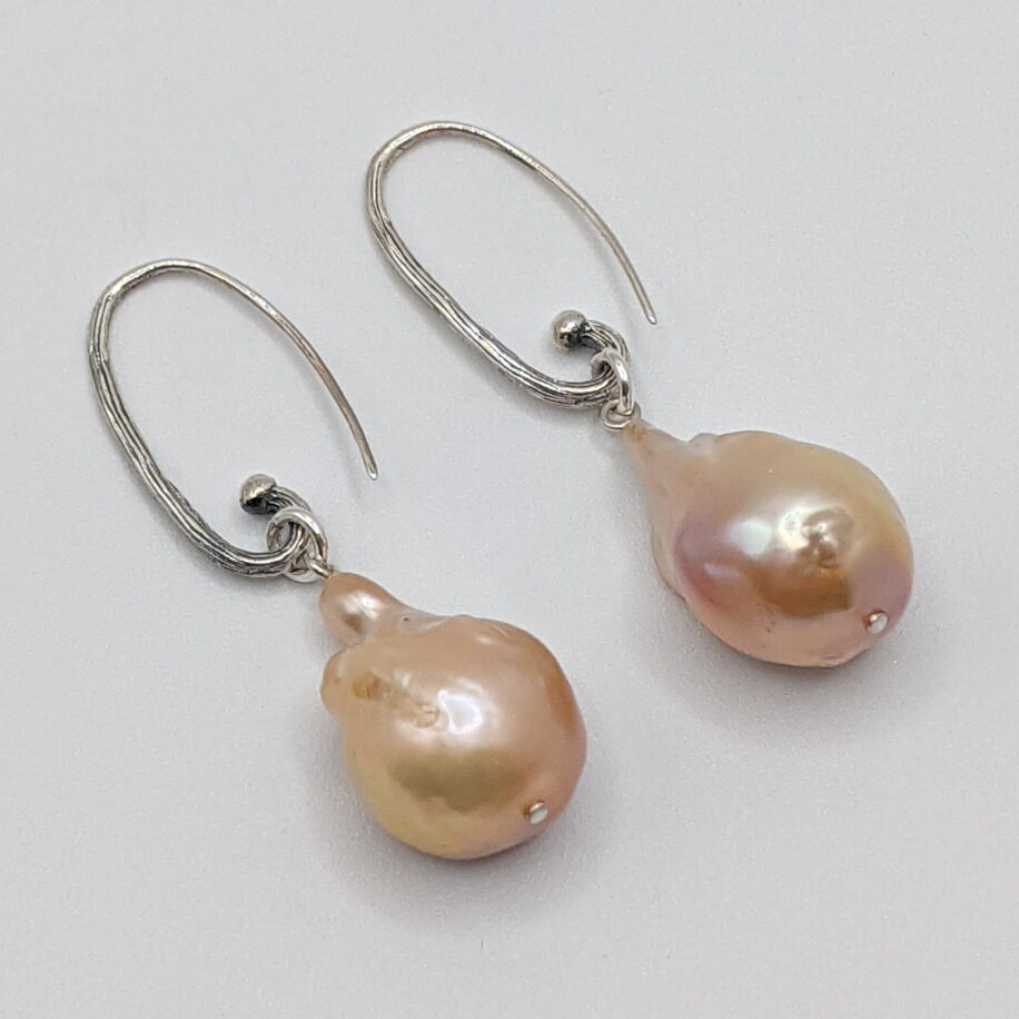 Pink Baroque Pearl Earrings with Sterling Silver Hammered Hoops by Val Nunns at The Avenue Gallery, a contemporary fine art gallery in Victoria, BC, Canada.