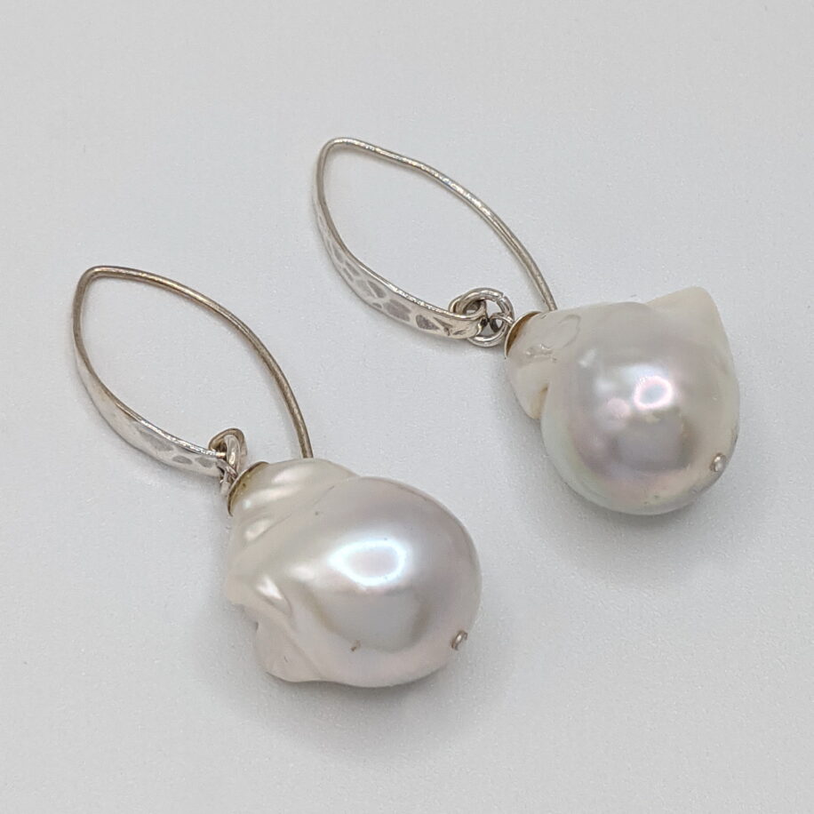 White Baroque Pearl Earrings with Hammered Sterling Silver Wires by Val Nunns at The Avenue Gallery, a contemporary fine art gallery in Victoria, BC, Canada.