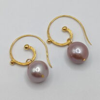 Mauve Edison Pearl Earrings with Curly Gold-Plated Wires by Val Nunns at The Avenue Gallery, a contemporary fine art gallery in Victoria, BC, Canada.