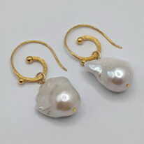 White Baroque Pearl Earrings with Curly Gold-Plated Wires by Val Nunns at The Avenue Gallery, a contemporary fine art gallery in Victoria, BC, Canada.