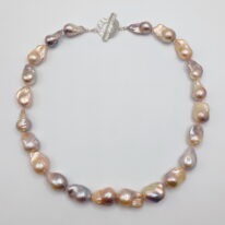 Baroque Pearl Necklace with Hammered Sterling Silver Toggle Clasp by Val Nunns at The Avenue Gallery, a contemporary fine art gallery in Victoria, BC, Canada.