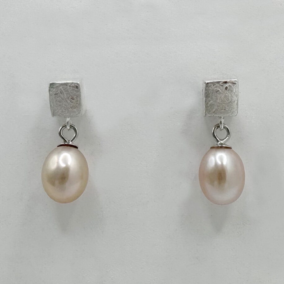 Scribbled Square Cube Stud Earrings with Pink Pearl Dangles by Chi’s Creations at The Avenue Gallery, a contemporary fine art gallery in Victoria, BC, Canada.