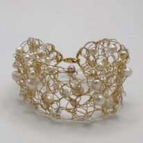 Gold-Fill Crochet Cuff with Clear Swarovski Crystals & White Pearls by Veronica Stewart at The Avenue Gallery, a contemporary fine art gallery in Victoria, BC, Canada.