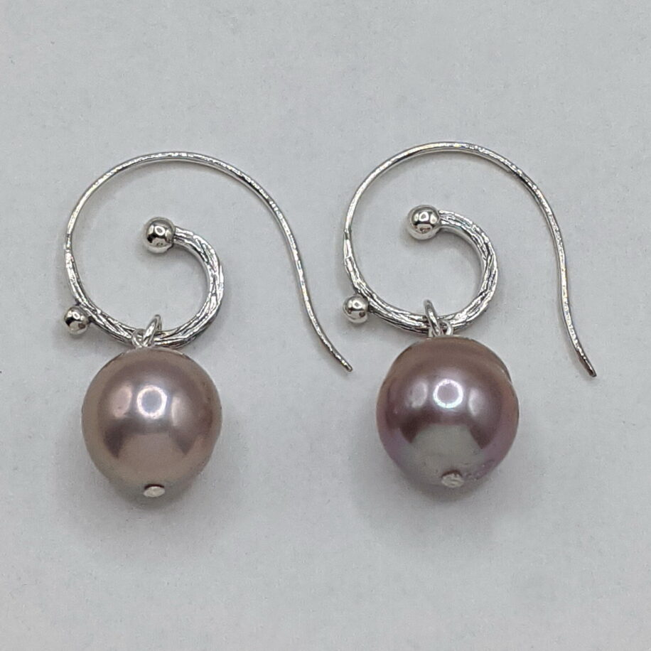 Edison Pearl Earrings with Sterling Silver Curly Wires by Val Nunns at The Avenue Gallery, a contemporary fine art gallery in Victoria, BC, Canada.