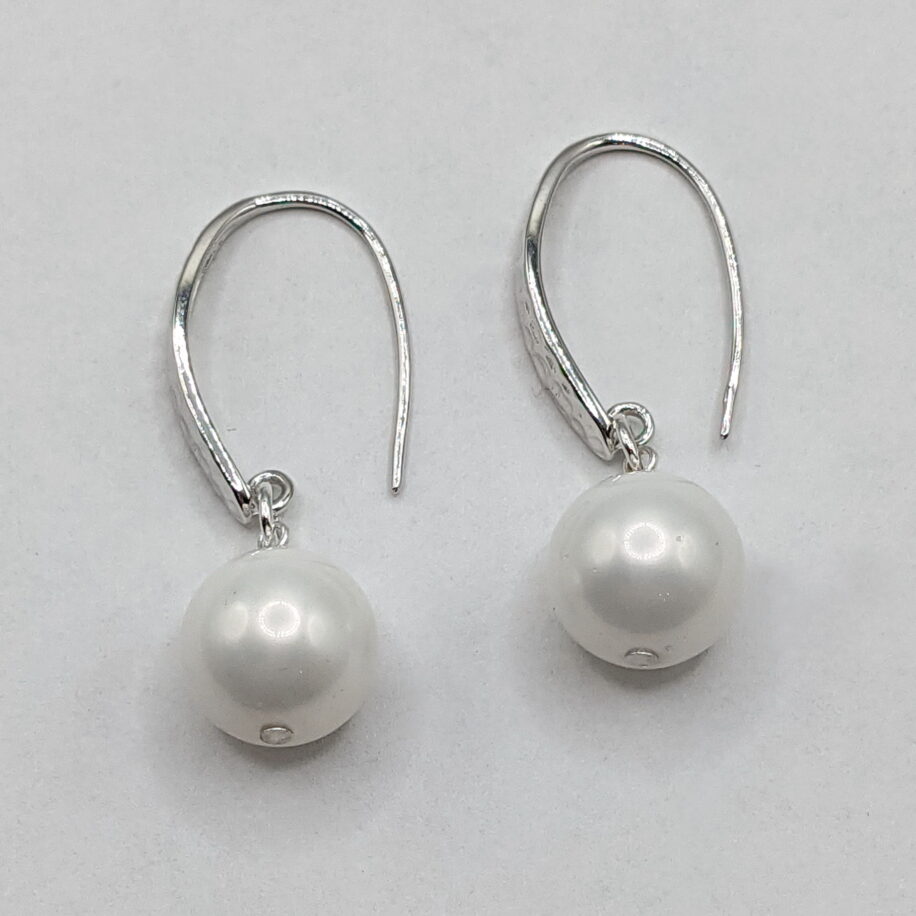 White Shell Pearl Earrings with Hammered Sterling Silver Wires by Val Nunns at The Avenue Gallery, a contemporary fine art gallery in Victoria, BC, Canada.