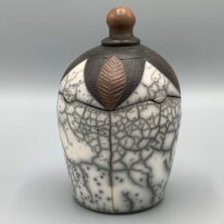 Naked Raku Large Lidded Jar by Jan Lovewell at The Avenue Gallery, a contemporary fine art gallery in Victoria, BC, Canada.