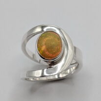 Buttonhole Band Ring with Ethiopian Opal by A & R Jewellery at The Avenue Gallery, a contemporary fine art gallery in Victoria, BC, Canada.