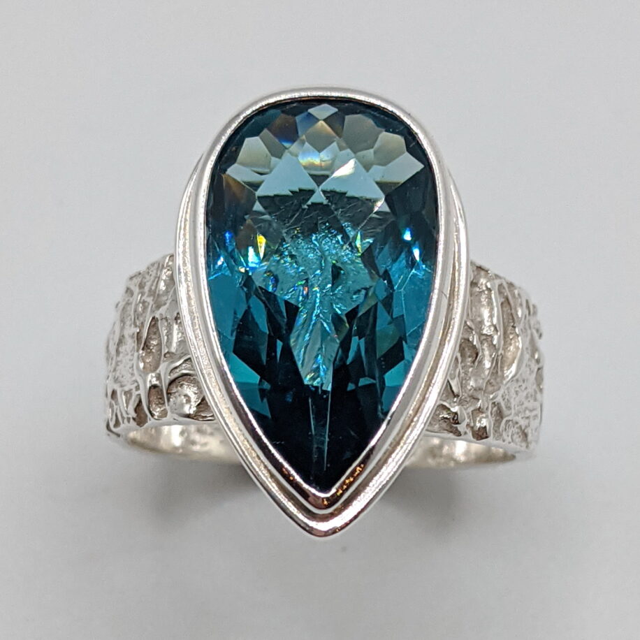 Lunar Band Ring with London Topaz by A & R Jewellery at The Avenue Gallery, a contemporary fine art gallery in Victoria, BC, Canada.