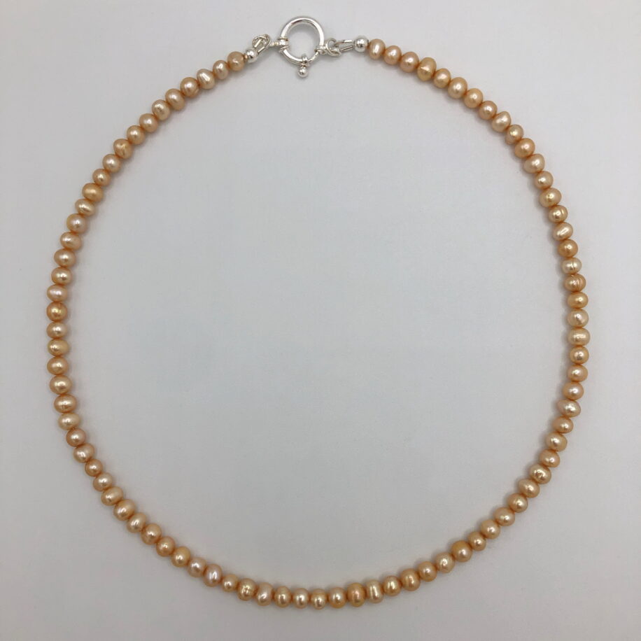 Apricot Freshwater Pearl Necklace by Val Nunns at The Avenue Gallery, a contemporary fine art gallery in Victoria, BC, Canada.