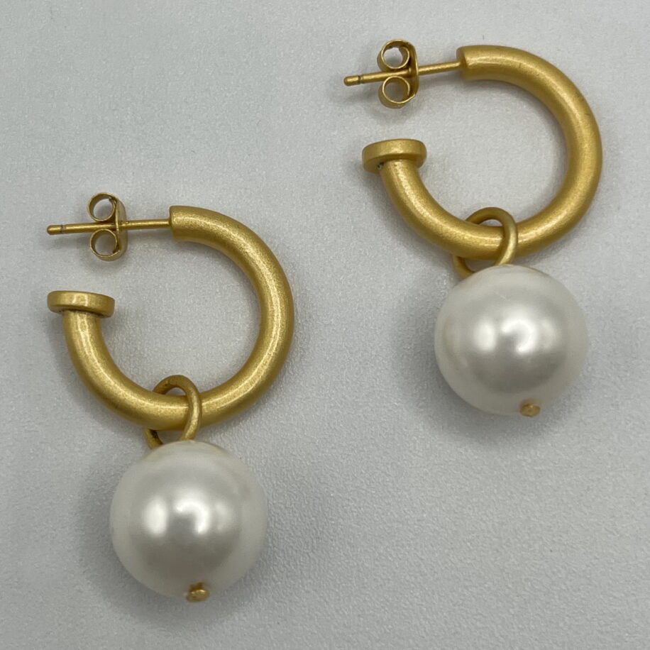 White Shell Pearl & Yellow Gold-Plated Hoop Earrings by Val Nunns at The Avenue Gallery, a contemporary fine art gallery in Victoria, BC, Canada.