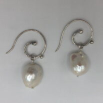 White Baroque Pearl & Hammered Curly Sterling Silver Wire Earrings by Val Nunns at The Avenue Gallery, a contemporary fine art gallery in Victoria, BC, Canada.