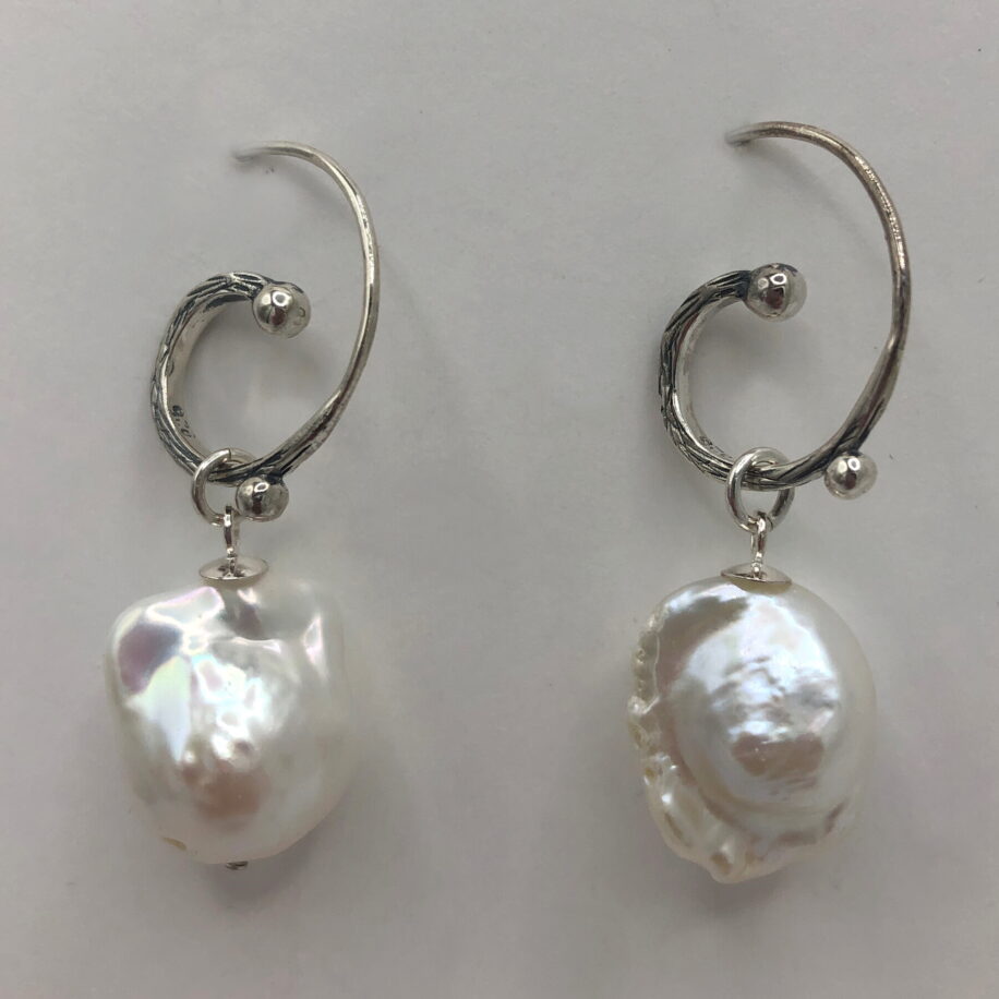 White Baroque Pearl & Hammered Curly Sterling Silver Wire Earrings by Val Nunns at The Avenue Gallery, a contemporary fine art gallery in Victoria, BC, Canada.