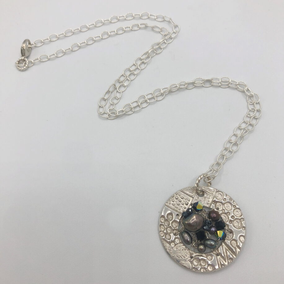 Small Round Textured Pendant by Veronica Stewart at The Avenue Gallery, a contemporary fine art gallery in Victoria, BC, Canada.