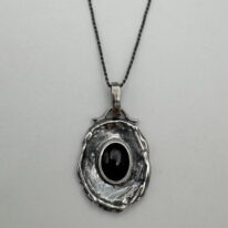 Wax Seal Pendant with Garnet by A & R Jewellery at The Avenue Gallery, a contemporary fine art gallery in Victoria, BC, Canada.