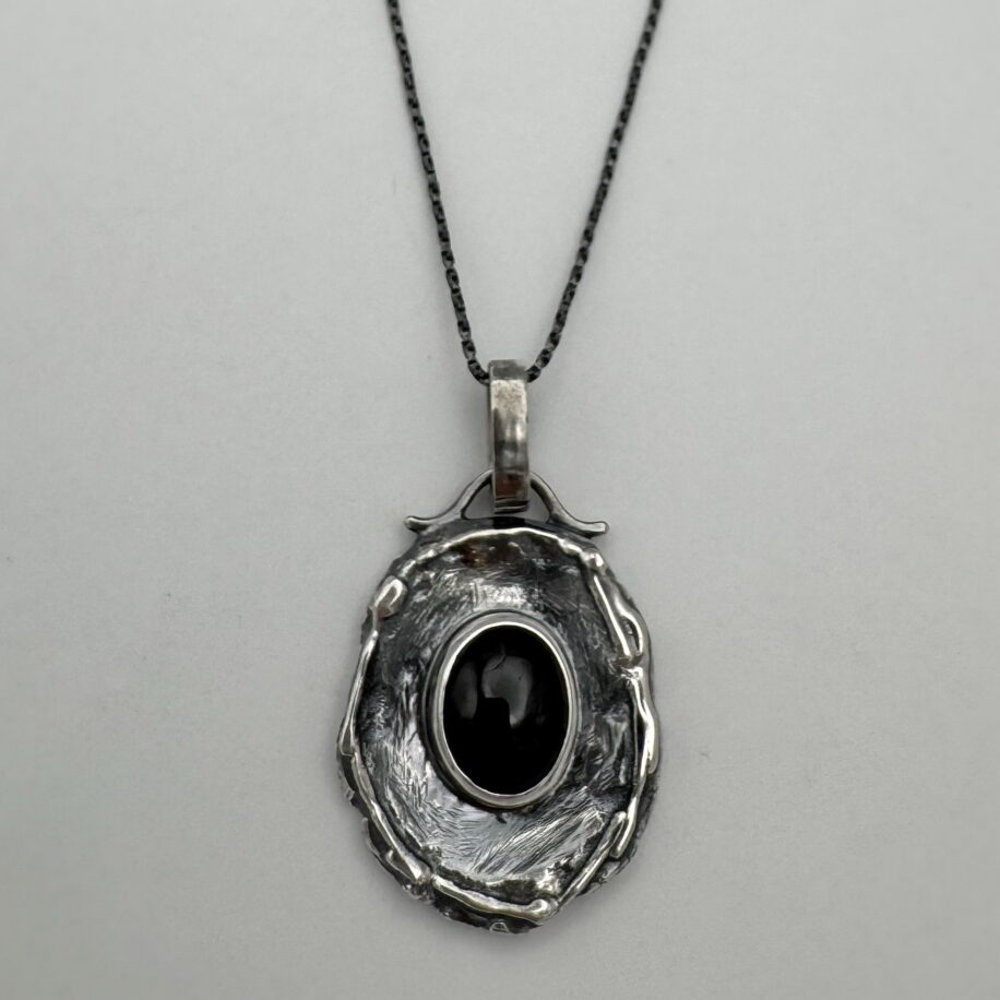 Wax Seal Pendant with Garnet by A & R Jewellery at The Avenue Gallery, a contemporary fine art gallery in Victoria, BC, Canada.