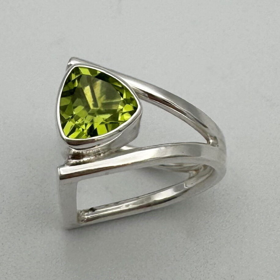 D-Book Band Ring with Peridot by A & R Jewellery at The Avenue Gallery, a contemporary fine art gallery in Victoria, BC, Canada.